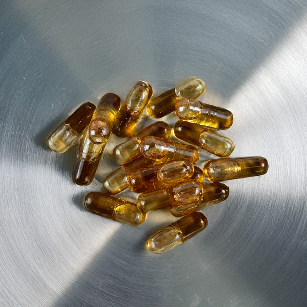 Tas de gélules au CBD oranges